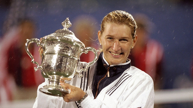 Steffi Graf of Germany holds the Womens Singles US Open Tournament trophy